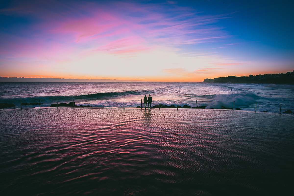 australia silhouette photo of couple at seashore water
